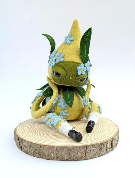 Hannakin - 'Forget Me Not' - wool felt, thread, Sculpey, glass beads and mixed media on raw pine wood base