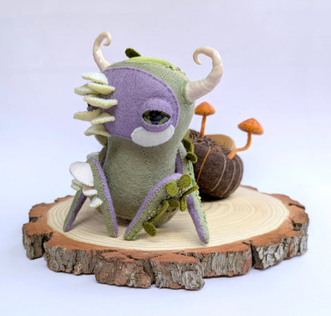 Hannakin - 'Hermit Gastropod' - wool felt, thread, embroidery floss, Sculpey, wire and mixed media on raw pine wood base