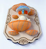 Hannakin - 'Sitting on the Shelf' - wool felt, cotton, glass beads, magnet and mixed media on birch plywood plaque