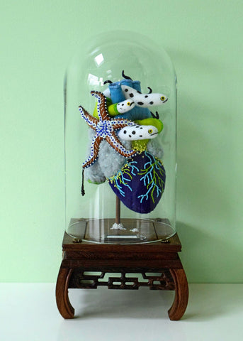 Hine Mizushima - 'Anatomical Heart, Inhabited (Shallow)' - felt, beads, sequins, yarn, wood, wire and glass dome
